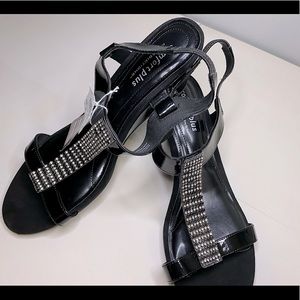 Black Fashion sandals with 2 in heels and gems on the top strap.